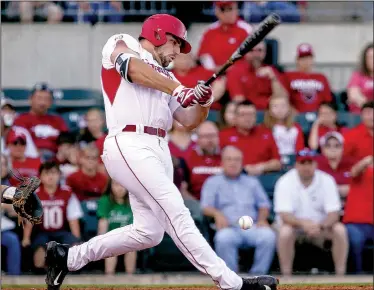  ?? Arkansas Democrat-Gazette/MITCHELL PE MASILUN ?? Arkansas Razorbacks first baseman Chad Spanberger fouls a ball off his foot during Wednesday’s game against Memphis at DickeyStep­hens Park in North Little Rock. Spanberger would eventually provide the Razorbacks with all of the offense they would need,...