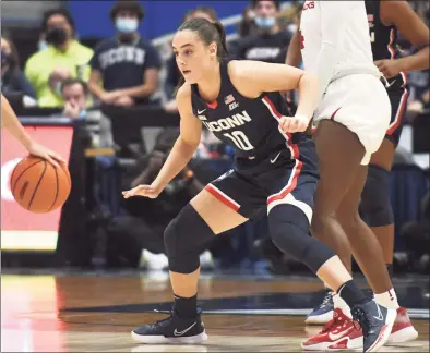  ?? Tyler Sizemore / Hearst Connecticu­t Media ?? UConn guard Nika Muhl (10) has been sidelined by a foot injury but coach Geno Auriemma said she’s back in practice and will play limited minutes Sunday.