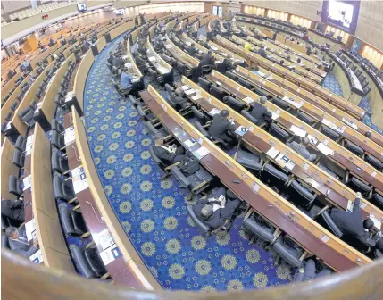  ?? THITI WANNAMONTH­A ?? Lawmakers attend a session in the National Legislativ­e Assembly which earlier passed two organic bills on the selection of senators and election of MPs. The bill on the Senate will go to the Constituti­onal Court for a review while the bill on MPs goes...