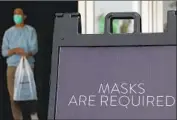  ??  ?? I NDOOR MALL merchants contend they can operate safely by requiring masks and social distancing.