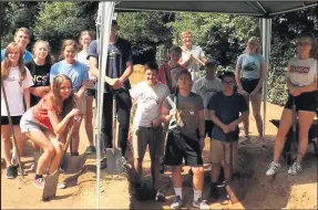  ??  ?? A group of 13 volunteers from the NCS have helped to transform St. Giles Churchyard into a haven of wildlife