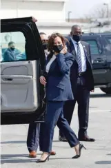  ??  ?? Harris steps into her motorcade after arriving at Midway Airport on Tuesday.
