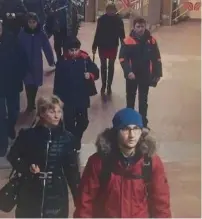  ?? (Reuters) ?? AKBARZHON JALILOV (foreground, right) is shown in this still taken from security footage as he walks in a St. Petersburg’s metro station prior to Monday’s blast.