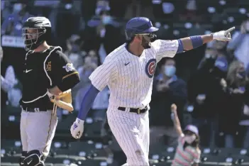  ?? NAM Y. HUH ?? CHICAGO CUBS’ KRIS BRYANT (RIGHT) points after hitting a solo home run as Pittsburgh Pirates catcher Jacob Stallings looks to the field during the third inning of a baseball game in Chicago Saturday.