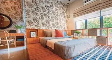  ??  ?? The use of a more contempora­ry botanic wallpaper and platform bedding will enhance a natural bedroom theme for a more grounded sleeping atmosphere.