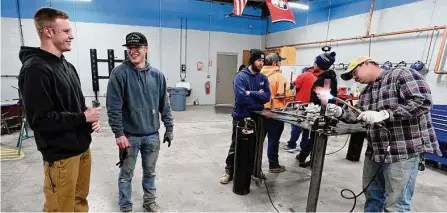  ?? Mark Zaleski/associated Press ?? Payton Lane, 19, left, and Boone Williams, 20, talk during a second-year apprentice training program at the Plumbers and Pipefitter­s Local Union 572 facility. The union is working with young adults who graduated and are taking career routes other than college.