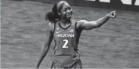  ?? ERIC GAY/AP ?? Arizona’s Aari McDonald celebrates after the semifinal win against Connecticu­t on Friday at the Alamodome in San Antonio.