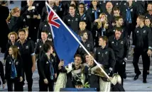  ?? GETTY IMAGES ?? The New Zealand team files in with flag-bearer Peter Burling.