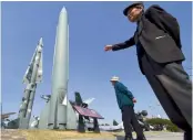  ?? AFP ?? Visitors look at replicas of a North Korean Scud-B missile and a South Korean Nike missile at the Korean War Memorial in Seoul on Wednesday. —