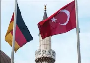  ??  ?? German and Turkish flags outside a Duisburg mosque