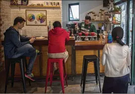  ?? DANIELE VOLPE / THE NEW YORK TIMES ?? Rojo Cerezo, a coffee shop in Guatemala City, joins an expanding community of shops where baristas point out the peach and raisin notes in the daily special and tasting classes that are scheduled each Saturday.