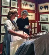  ??  ?? Far left: Earle D. Vandekar of Knightsbri­dge Inc. displays 19th-century sailors’ woolworks or “woolies.”
Left: Denise De Laurentis Fine Art with a customer at the 2018 Nantucket Summer Antiques Show.