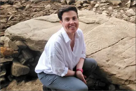  ??  ?? Dr Clíodhna Ni Lionáin at the megalithic passage tomb in County Meath.