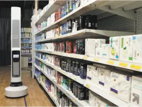  ?? Carlos Avila Gonzalez / The Chronicle ?? Tally rolls by a store shelf to scan items at Simbe headquarte­rs in South San Francisco. It could also be used in the future to enforce social distancing.