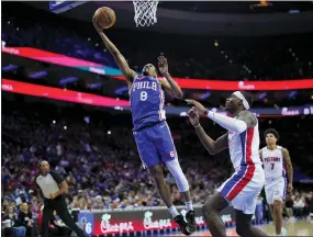  ?? MATT SLOCUM - THE ASSOCIATED PRESS ?? De’Anthony Melton, left, goes up for a shot past Detroit Pistons’ Jalen Duren during the first half Wednesday. The Sixers won, 113-93.