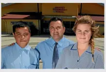  ?? CLINTON LLEWELLYN / FAIRFAX NZ ?? Hastings Intermedia­te principal Andrew Shortcliff­e, pictured here with former students Latu Amani (left) and Dayna Piwari, asks how much longer schools must wait for sustainabl­e funding.