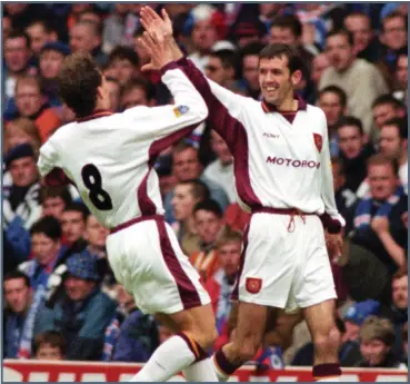  ??  ?? Owen Coyle scored a double that helped Motherwell celebrate a 2-0 win at Ibrox in 1997