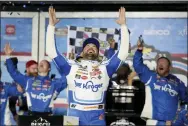  ?? JOHN RAOUX - THE ASSOCIATED PRESS ?? Ricky Stenhouse Jr. celebrates in Victory Lane after winning the Daytona 500 on Sunday.