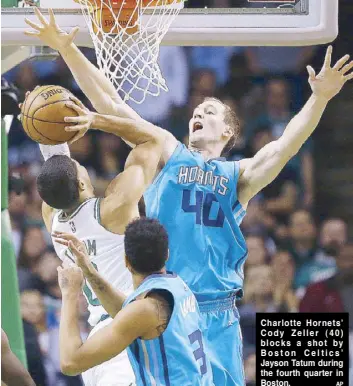  ??  ?? Charlotte Hornets’ Cody Zeller (40) blocks a shot by Boston Celtics’ Jayson Tatum during the fourth quarter in Boston.