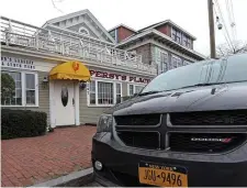  ?? MATT sTonE / HErAld sTAFF FilE ?? SUMMER JOBS AVAILABLE: A rental car from New York is parked in front of Persy’s Place restaurant in Hyannis last year. With 2020 faring better than expected, the Cape is already predicting a banner year, but some are worried they won’t attract the needed workers.