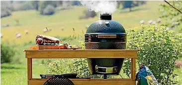  ??  ?? An example of a ceramic ‘‘egg’’-style barbecue, which revitalise­d charcoal-fuelled cooking.