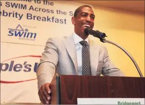  ?? Brian A. Pounds / Hearst Connecticu­t Media file photo ?? Then-UConn men’s basketball coach Kevin Ollie addresses the St. Vincent's Swim Across the Sound benefit breakfast at the Holiday Inn in Bridgeport in 2015.
