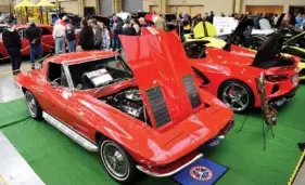  ?? STAFF PHOTO BY ROBIN RUDD ?? Daniel Smith of Hixson displays a 1963 Corvette at the 54th annual World of Wheels custom auto show at the Chattanoog­a Convention Center in January 2022.