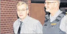  ?? IAN FAIRCLOUGH ?? Leslie Greenwood is led into Supreme Court in Kentville during his trial on two charges of first-degree murder. He’s launching an appeal of his conviction.