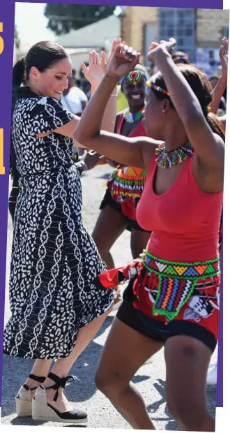  ?? Pictures: WIREIMAGE / PA / GETTY IMAGES EUROPE ?? Serious moves: The Duchess dances with locals in the Nyanga township on the couple’s tour of South Africa last September