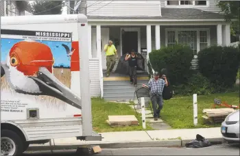  ?? Hearst Connecticu­t Media file photo ?? A 2016 eviction underway in Norwalk. On March 16, the the state’s judicial branch restricted court business through March 27 to pressing matters that do not include evictions or foreclosur­es.