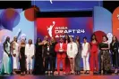  ?? ?? The 2024 WNBA draft class poses for picture with Jake From State Farm on Monday night at the Brooklyn Academy of Music. Photograph: Melanie Fidler/NBAE/ Getty Images