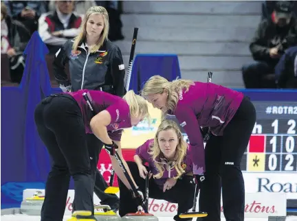  ?? ADRIAN WYLD/THE CANADIAN PRESS ?? Jennifer Jones, left, lost Wednesday to Chelsea Carey, middle, and her team at the Roar of the Rings in Ottawa.