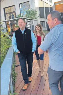  ??  ?? Camera operator Chris McCaffrey records Oklahoma City real estate agents Denise and Troy Schroder for another appearance on HGTV's “House Hunters,” their third since 2014. [PHOTOS PROVIDED]