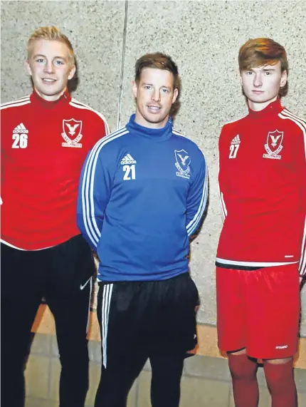  ??  ?? ALL SMILES: Deveronval­e manager Steve Dolan with players, from left, Lewis Dunbar, Grant Pennet, Matthew