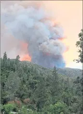  ?? CARRIE ANDERSON VIA AP ?? The Ferguson fire burns near Yosemite National Park on Sunday, as seen from El Portal.