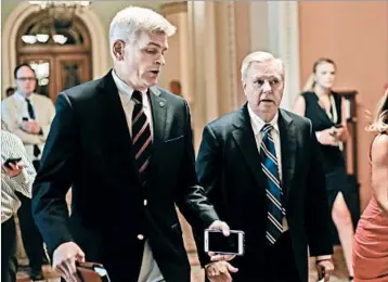  ?? PABLO MARTINEZ MONSIVAIS/AP ?? Sen. Bill Cassidy, R-La., left, and Sen. Lindsey Graham, R-S.C., are sponsoring legislatio­n to repeal the Affordable Care Act.