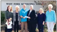  ?? Courtesy photo ?? Recently H&R Block of Fayettevil­le employees volunteere­d their time to raise money for the West Fork Municipal Library during WestFest 2017. All money raised was matched, and on Oct. 23 they presented a check for $960 to the library for purchase of new...