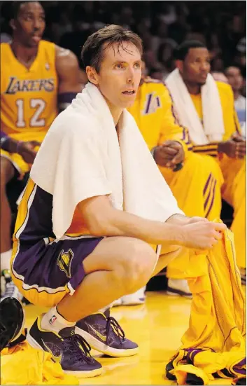  ?? — GETTY IMAGES ?? Steve Nash of the Los Angeles Lakers watches his team from the sidelines last week. A collision with another player took him out of the game Wednesday.