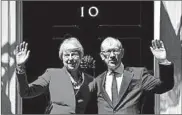  ?? BEN STANSALL/GETTY-AFP ?? Outgoing Prime Minister Theresa May and her husband, Philip, gather outside 10 Downing St. in London.