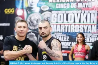  ?? AFP ?? GLENDALE: (R-L) Vanes Martirosya­n and Gennady Golovkin of Kazakhstan pose in the ring during a media workout at the Glendale Fighting Club in Glendale, California.—