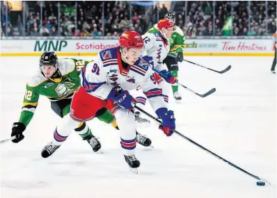  ?? TIFFANY LUKE KITCHENER RANGERS ?? Kitchener Rangers forward Matthew Sop corrals the puck against the London Knights in Game 1 of their OHL Western Conference semifinal Thursday at Budweiser Gardens.