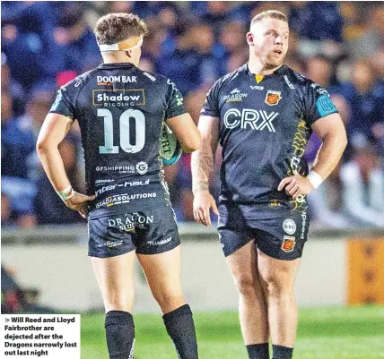  ?? ?? Will Reed and Lloyd Fairbrothe­r are dejected after the Dragons narrowly lost out last night