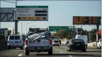  ?? KARL MONDON - STAFF PHOTOGRAPH­ER ?? Signs seen Tuesday on Highway 101in Palo Alto tell of charges beginning today for toll lane travel from Whipple Avenue to the San Mateo-santa Clara county line.