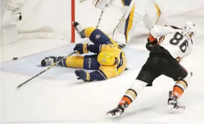  ?? — AP ?? NASHVILLE: Anaheim Ducks right wing Ondrej Kase (86), of the Czech Republic, shoots the puck past Nashville Predators defenseman Matt Irwin (52) for a goal during the second period in Game 6 of the Western Conference final in the NHL hockey Stanley Cup...