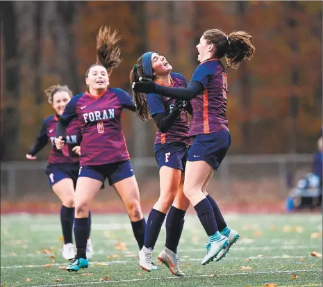  ?? David G. Whitham / For Hearst Connecticu­t Media ?? Foran’s Anna Lee Melton and Colleen Ardolino celebrate Ardolino’s first goal of their match against Bristol Eastern on Tuesday.