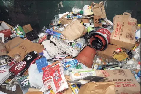  ?? Ned Gerard / Hearst Connecticu­t Media ?? A look inside one of the dumpsters where residents can dump their recycling items at the town’s transfer station in Fairfield on Friday.