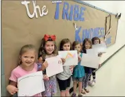  ?? / Spencer Lahr ?? Glenwood Primary students Sophia Winters (from left), Brooklyn Taylor, Cheyenne Cochran, Zoey Miller, Mia Benter and Lyra White hold up their artwork on the first day of school Thursday.