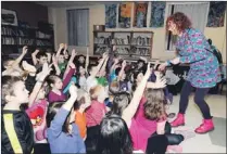  ??  ?? The students’ enthusiasm was evident as Hanlon, in her character of “Miss Debbie” sparked lots of participat­ion, shown in the photos below.