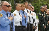  ??  ?? Palm Beach County Fire Rescue and Sheriff Officers attend a 9/11 Remembranc­e Ceremony at the Patriot Memorial in Wellington.