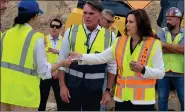  ?? SUSAN SMILEY — MEDIANEWS GROUP ?? Governor Gretchen Whitmer (right) with Macomb County Executive Mark Hackel touring part of the Innovate Mound project in Sterling Heights in July.